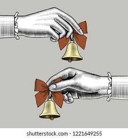 Female hands holding retro bells with red bows. Vintage engraving stylized drawing. Vector illustration