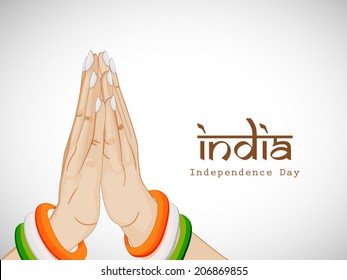 Female hands in Indian gesturing pose, Namaste on grey background for Indian Independence Day celebrations. 