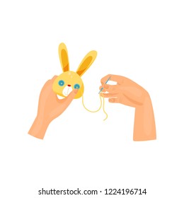 Female hands making soft toy using needle, top view. Handmade plush bunny. Creative hobby. Flat vector for tutorial book