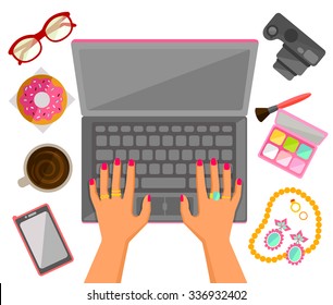 Female hands typing on a laptop with trendy items around