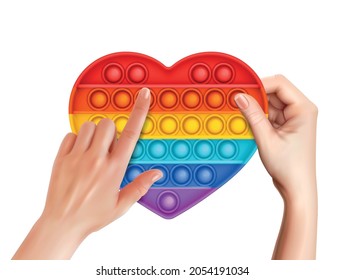 Female hands using trendy rainbow color pop it antistress toy in shape of heart realistic vector illustration