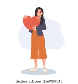 female holding big red heart as a symbol of self-love, care, and emotional support