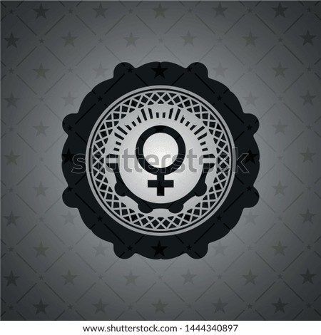 female icon inside black emblem