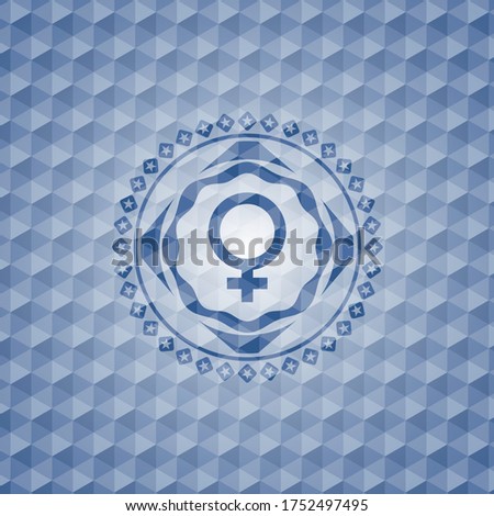female icon inside blue emblem with geometric pattern. 