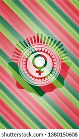female icon inside christmas colors badge.
