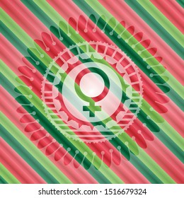 female icon inside christmas colors style badge.