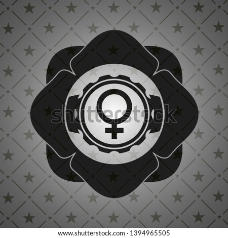 female icon inside dark emblem. Retro