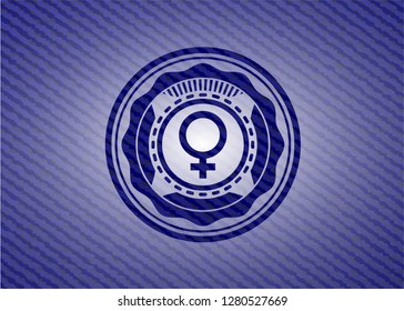 female icon inside emblem with denim high quality background