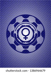 female icon inside emblem with denim texture