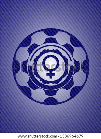 female icon inside emblem with denim texture