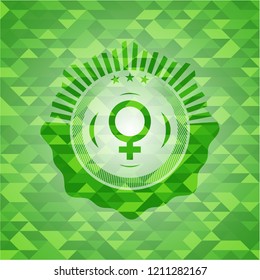 female icon inside green emblem with mosaic ecological style background