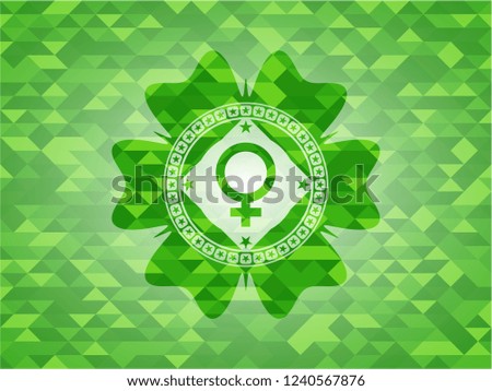 female icon inside green emblem with triangle mosaic background