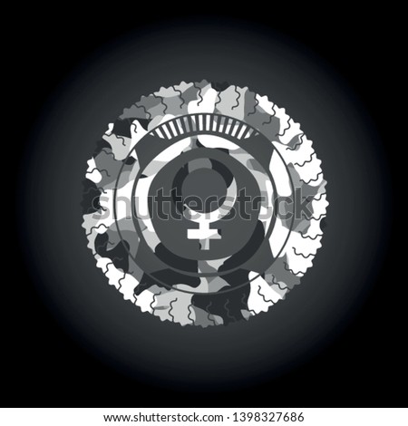 female icon inside grey camouflaged emblem