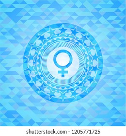 female icon inside light blue emblem with mosaic background