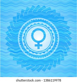 female icon inside light blue water wave style emblem.
