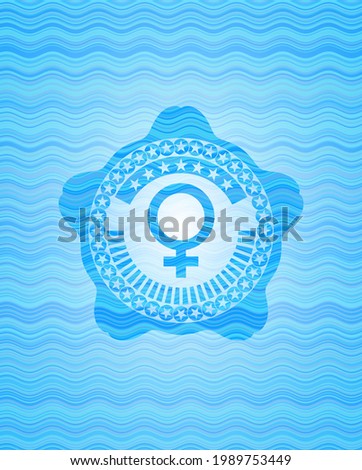 female icon inside light blue water wave badge. 