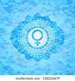 female icon inside realistic light blue emblem. Mosaic background