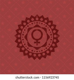 female icon inside red emblem