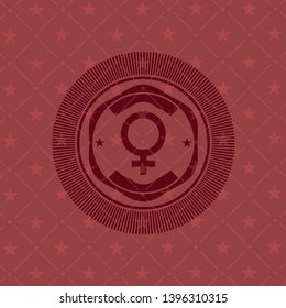 female icon inside red emblem