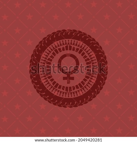 female icon inside red emblem. 