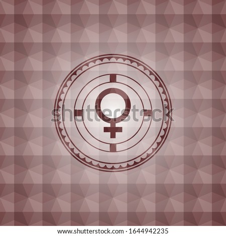 female icon inside red seamless emblem with geometric background.