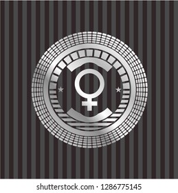 female icon inside silver badge