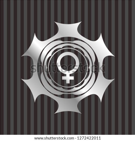 female icon inside silver badge