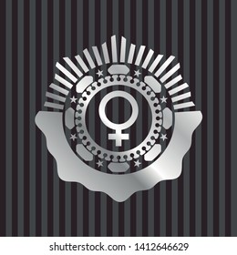 female icon inside silver shiny badge