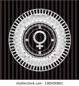 female icon inside silvery emblem or badge