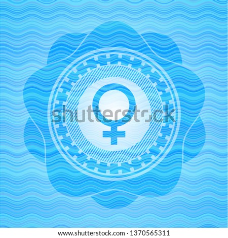 female icon inside water concept badge.