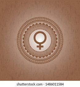 female icon inside wood emblem