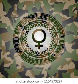 female icon on camouflaged pattern