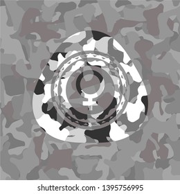 female icon on grey camouflaged texture