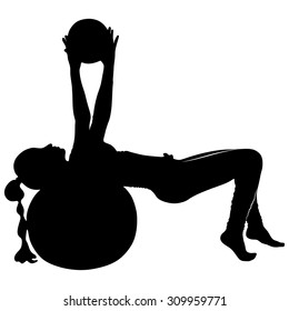 female instructor at stretching pilates exercises with finess ball
