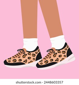 Female legs in the sneakers with leopard print