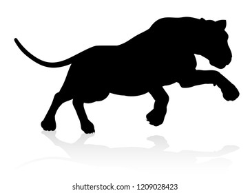 A Female Lion Or Other Big Cat Safari Animal In Silhouette