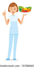 A female nurse wearing a white uniform has vegetables