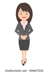 Female office worker standing with a smile