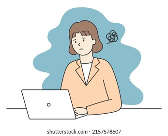 Female office worker who is confused in front of a computer
