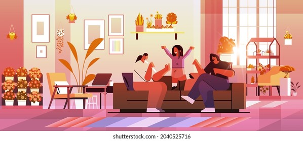 female parents playing with little child lesbian family transgender love LGBT community concept