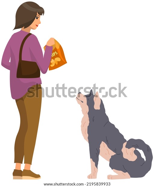 Female pet owner feeding dog with chips. Caring for\
animals, joint pastime with pets concept. Doggy and woman friend\
isolated on white background. Young lady giving food to domestic\
animal, cute