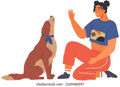 Female pet owner plays with dog. Caring for four-footed friend concept. Happy lady with puppy, domestic animal, human companion at home. Dog follows command, gives paw to woman. Girl training doggy