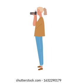 Female photographer holding a camera to take pictures. 