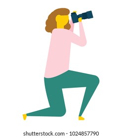 A female photographer kneeling down while taking a photo, flat vector icon 