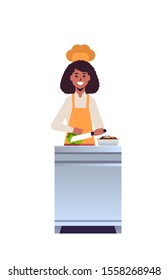 female professional chef cook chopping fresh vegetables on carving board african american woman restaurant worker in uniform preparing salad cooking food concept flat full length vertical vector