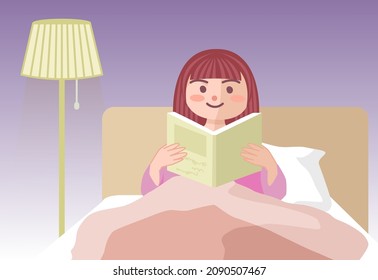 Female reading on the bed at night.