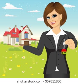 female realtor holding a model house and key