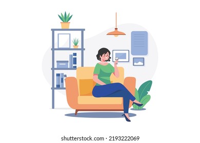 Female sit on armchair holding wineglass in hand