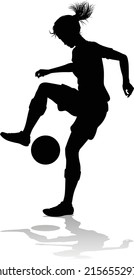 A female soccer football player woman in silhouettes