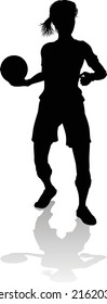 A female soccer football player woman in silhouettes